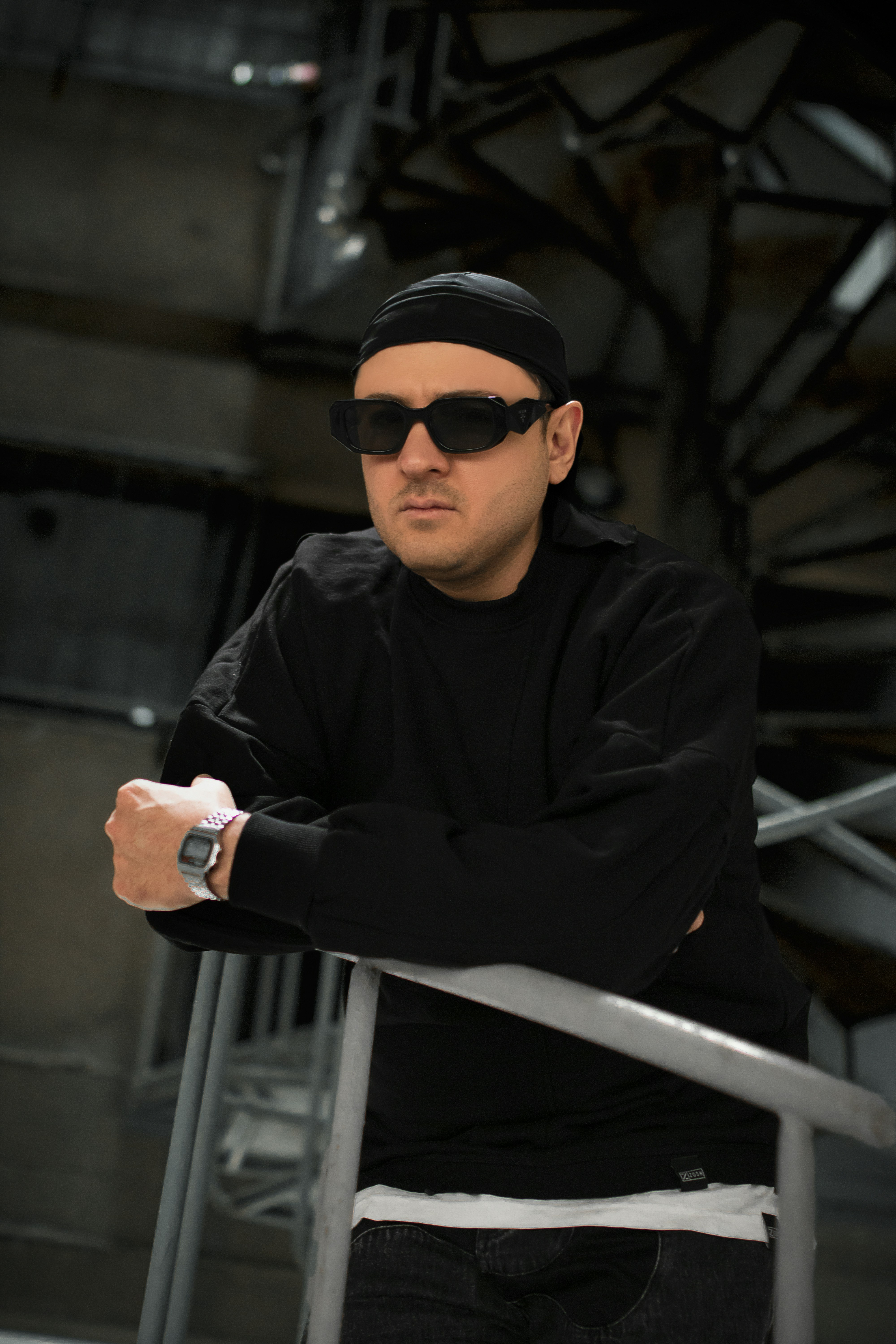 a man wearing sunglasses and a black shirt