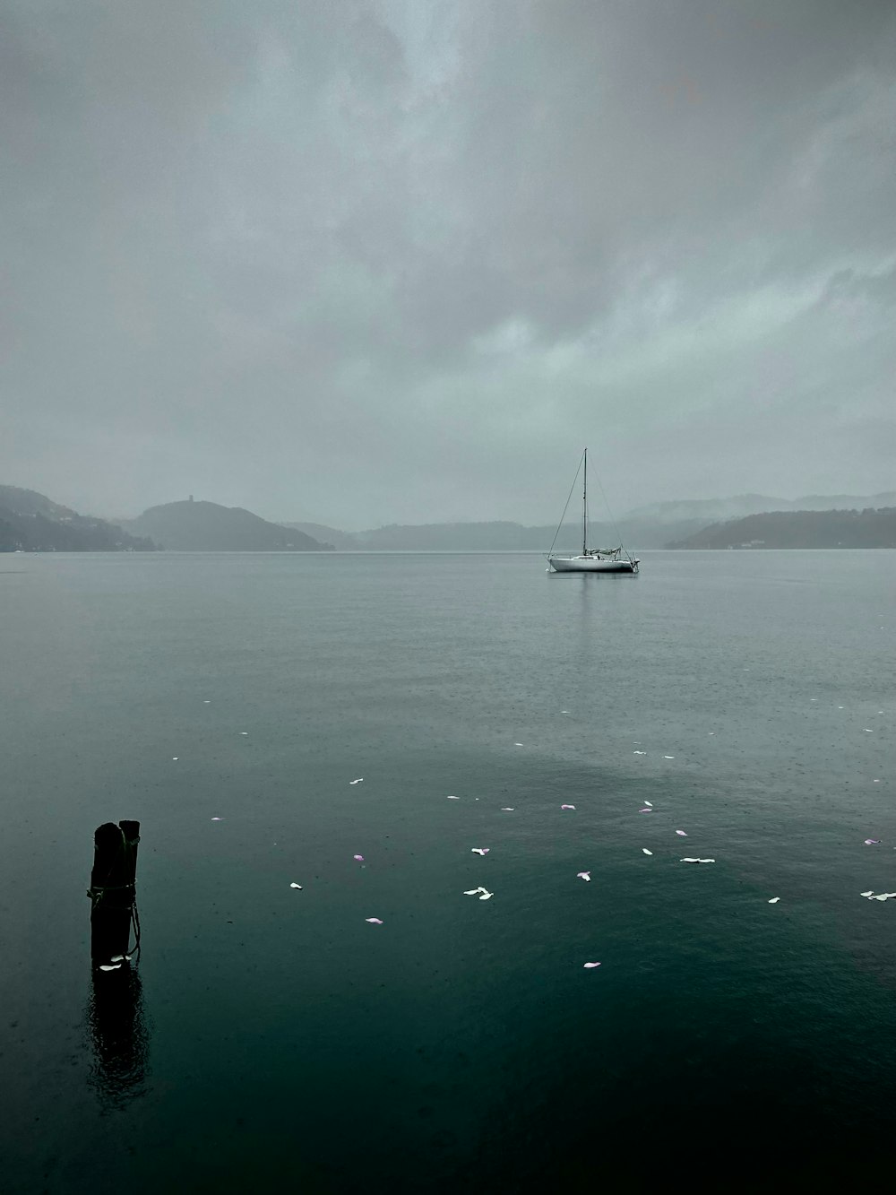 a boat floating on top of a large body of water