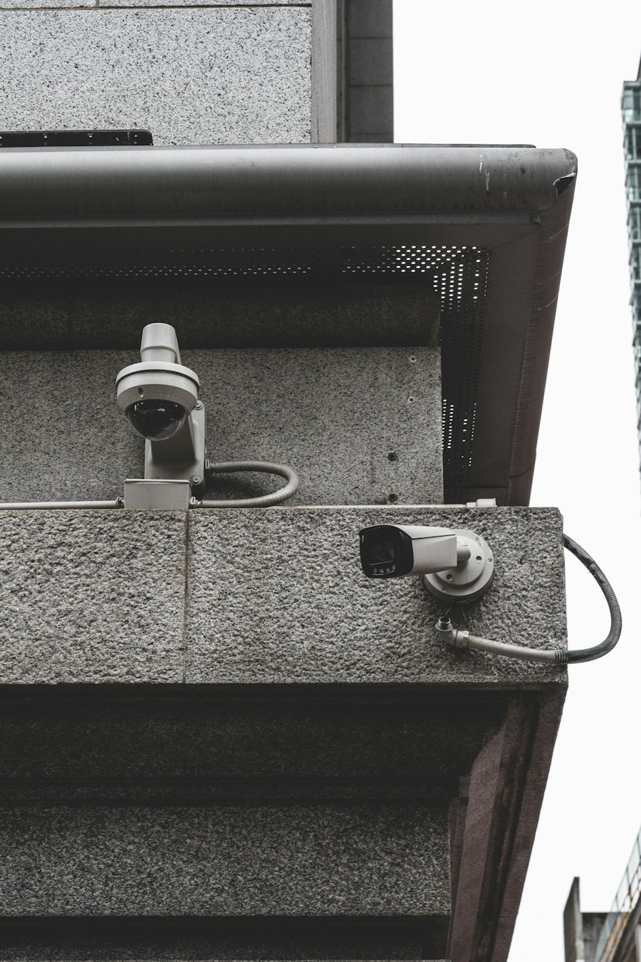 Surveillance camera installed on a building