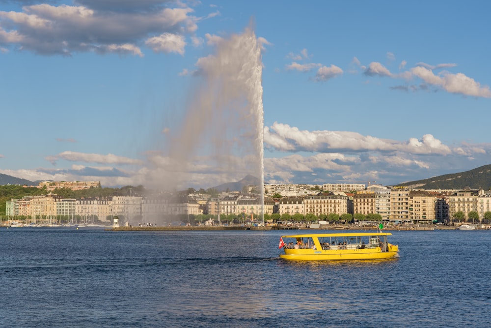 a yellow boat in a body of water