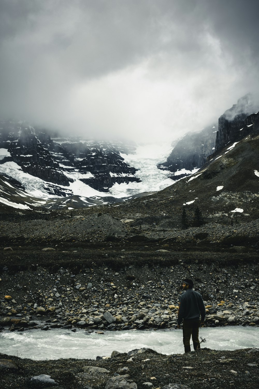 a man standing in the middle of a river