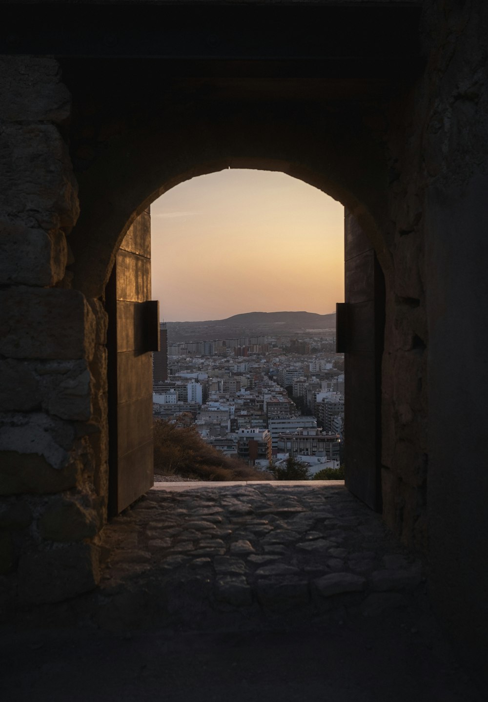 a view of a city through an archway