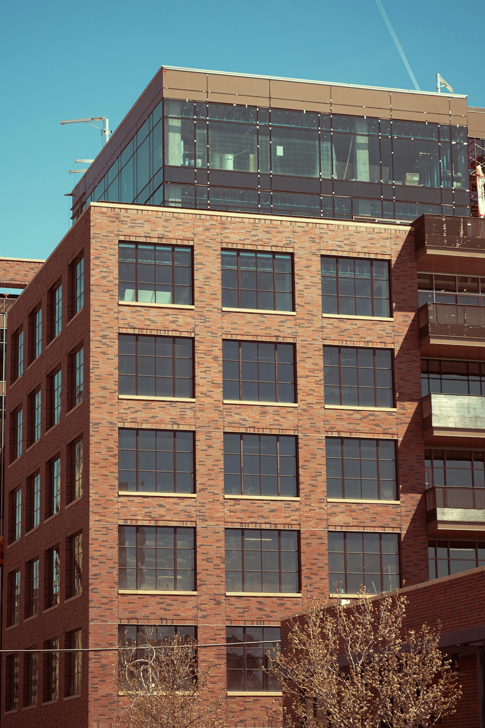 a tall brick building with lots of windows