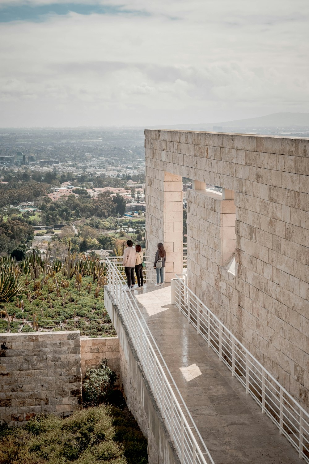 a couple of people standing on top of a building