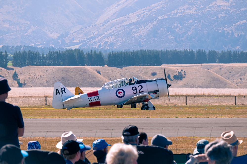 a small propeller plane on a run way