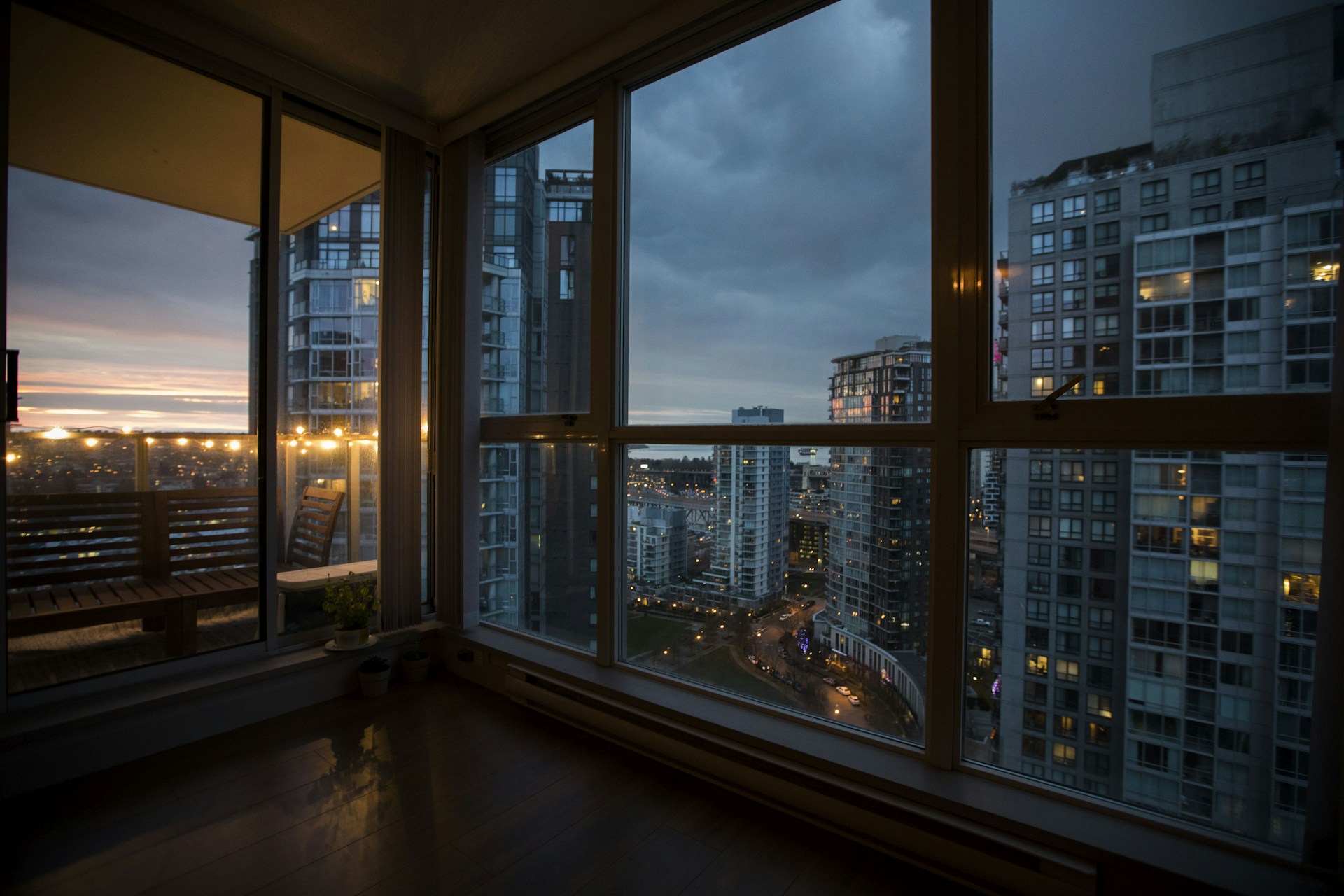 a room with a view of a city at night