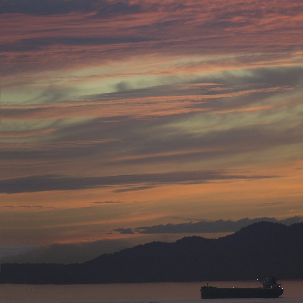 a large boat floating on top of a large body of water