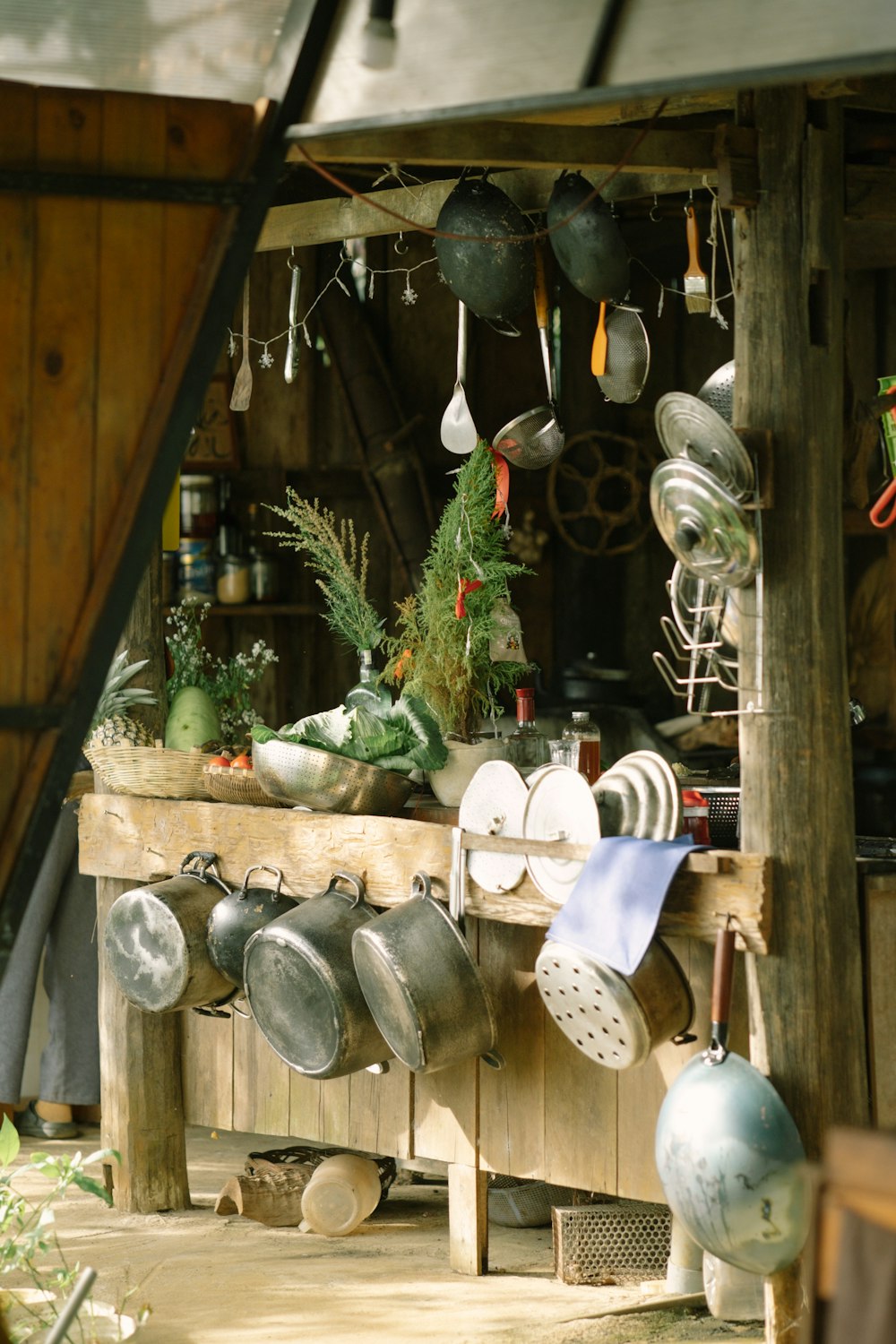 a kitchen with pots and pans hanging from the ceiling