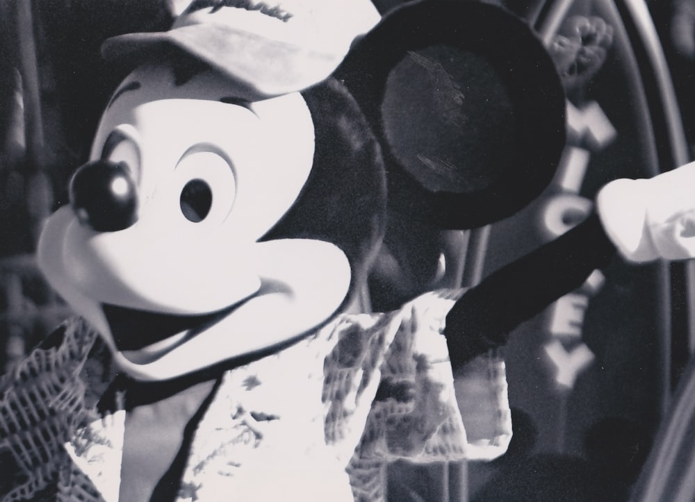 a black and white photo of a mickey mouse