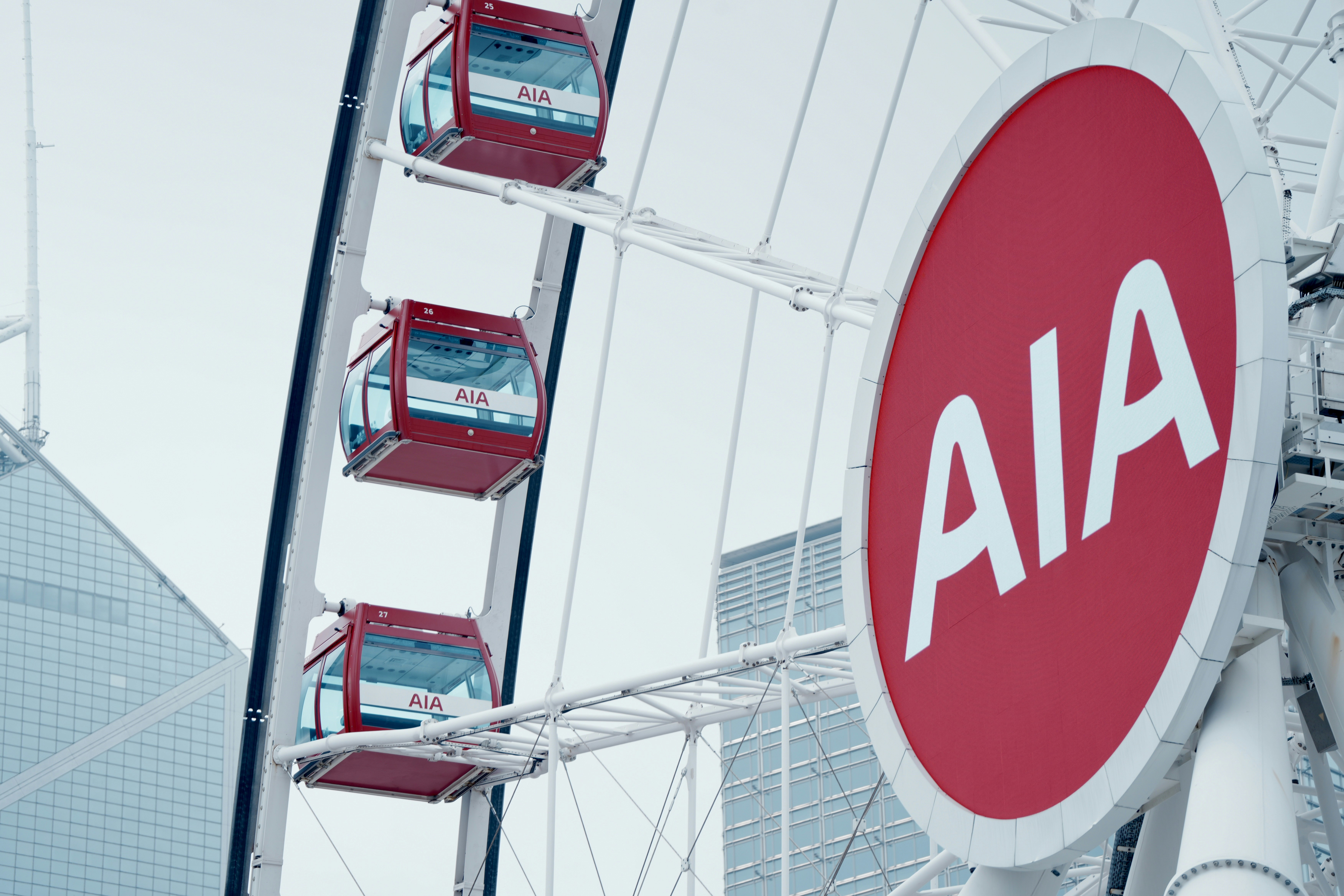 a ferris wheel with a red and white sign on it