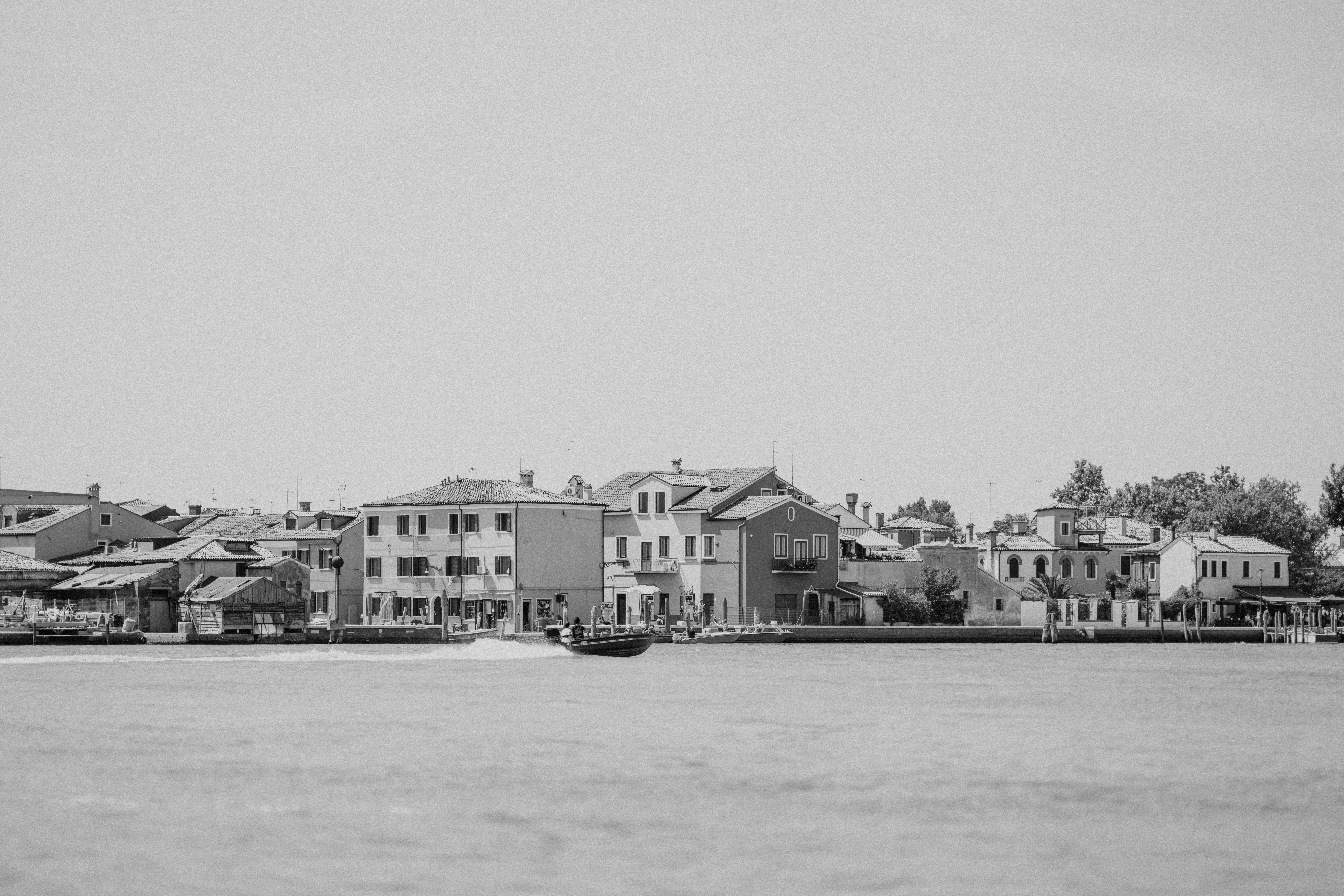 a black and white photo of a boat in the water