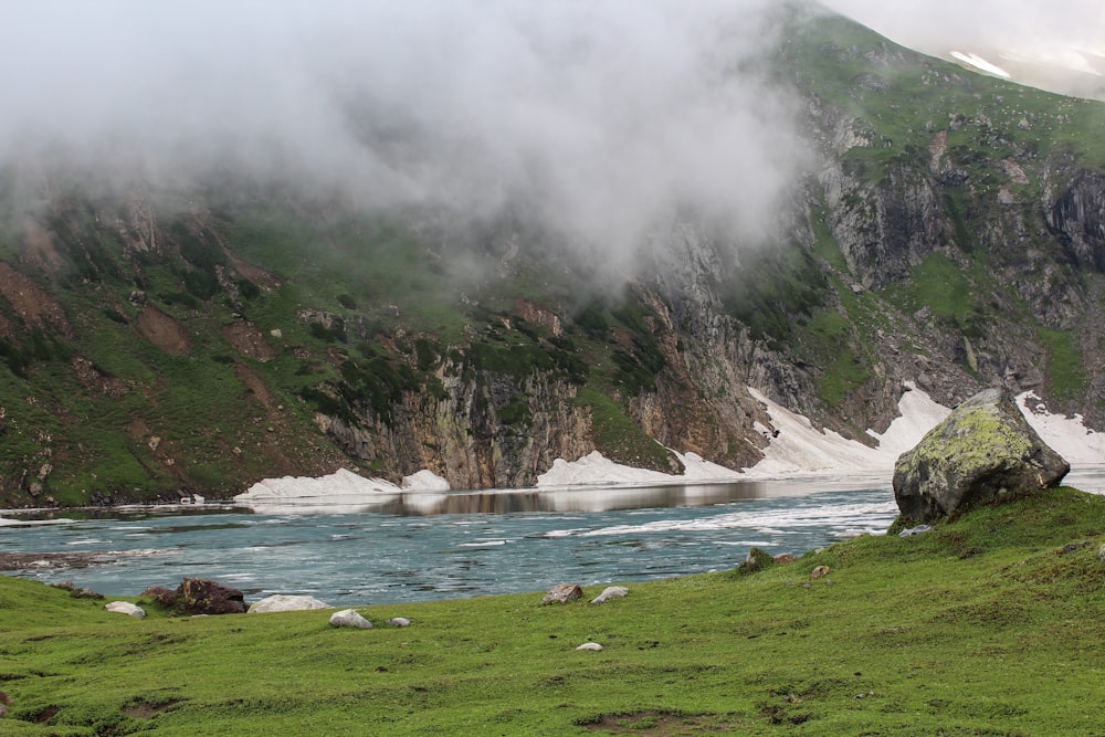 a mountain with a body of water in the middle of it