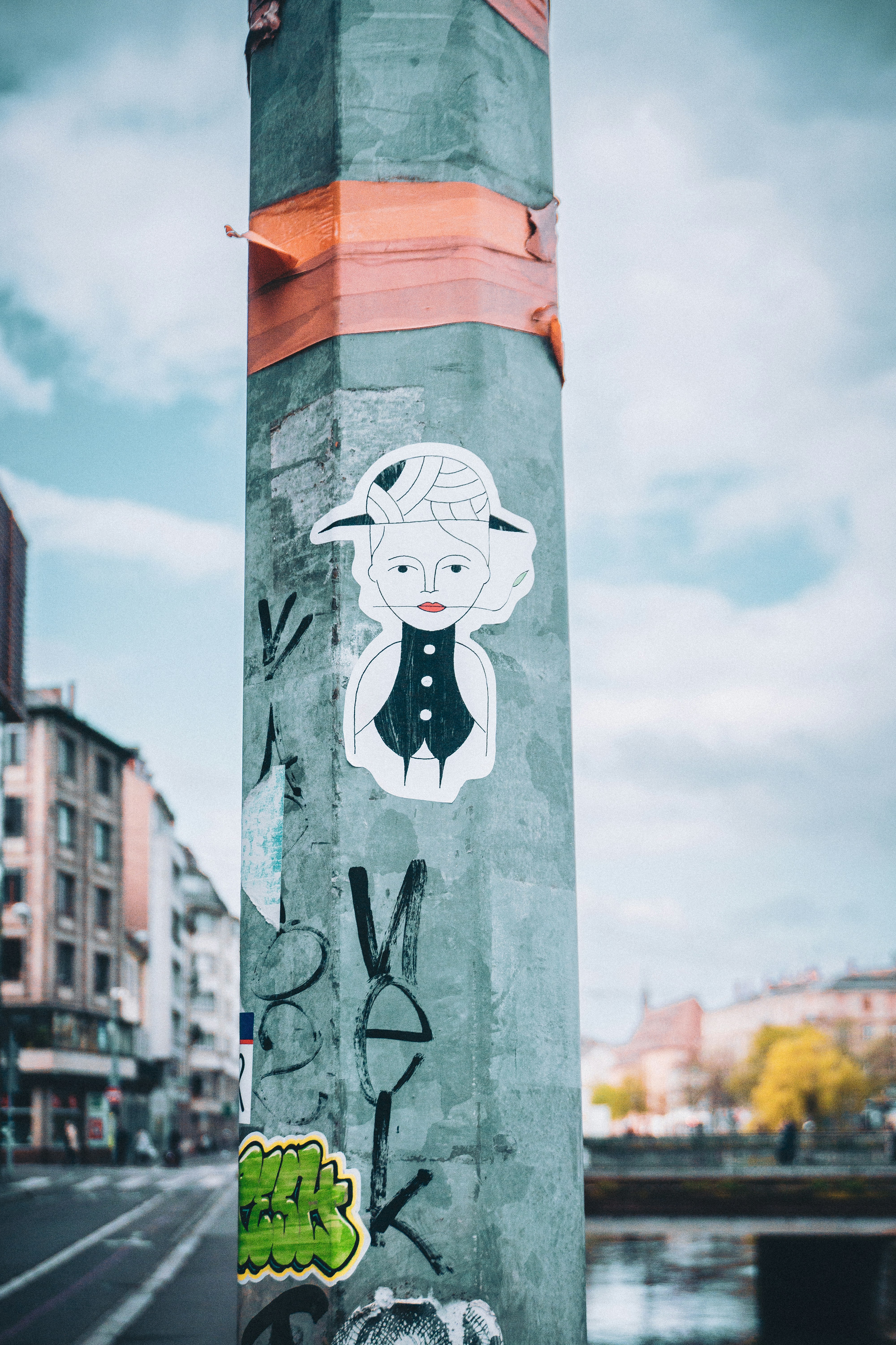 a pole with some stickers on it