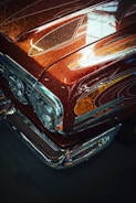 a close up of the front end of a classic car