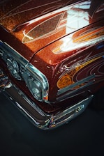 a close up of the front end of a classic car