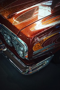 a close up of the front end of a classic car