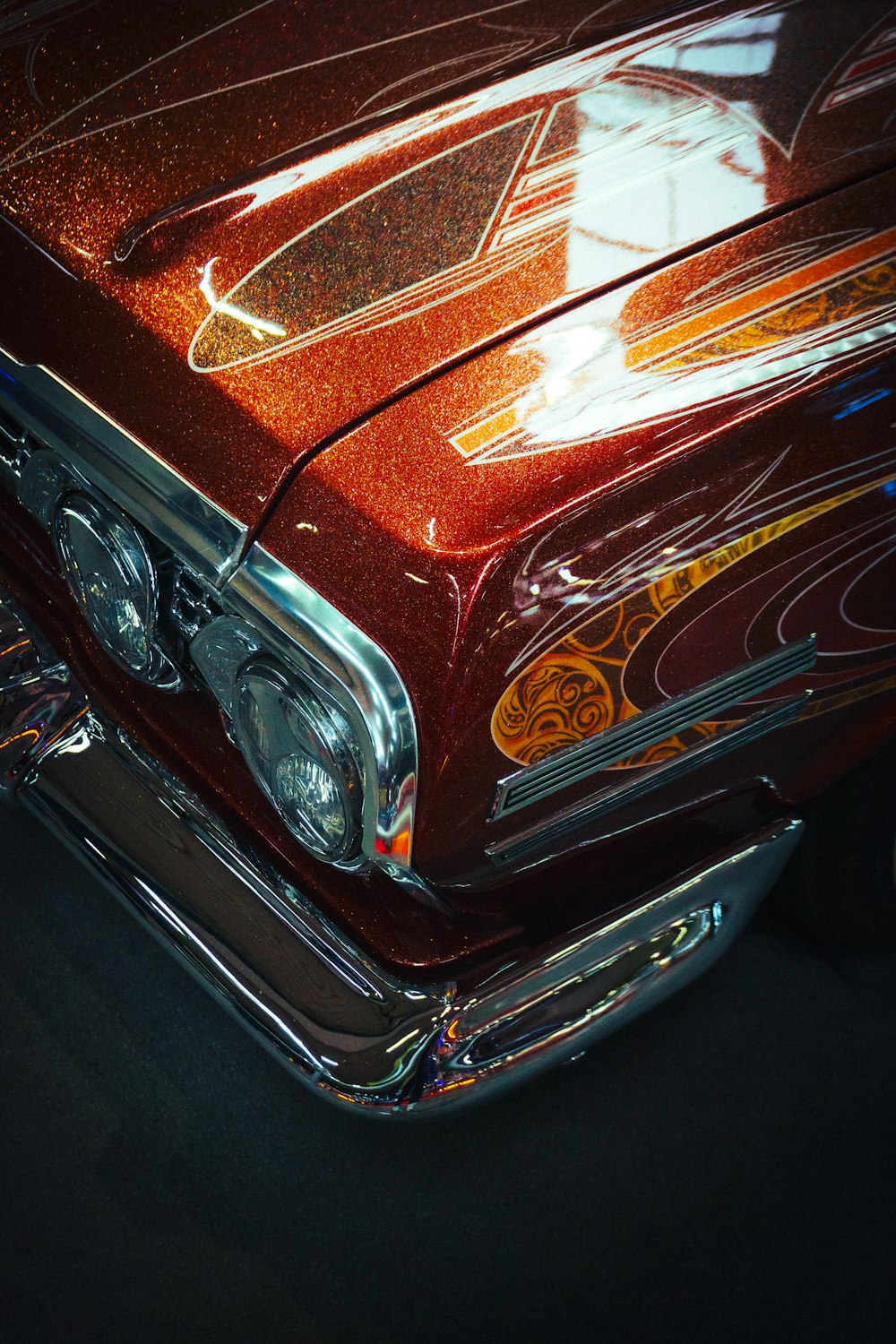 a close up of the front end of a classic car