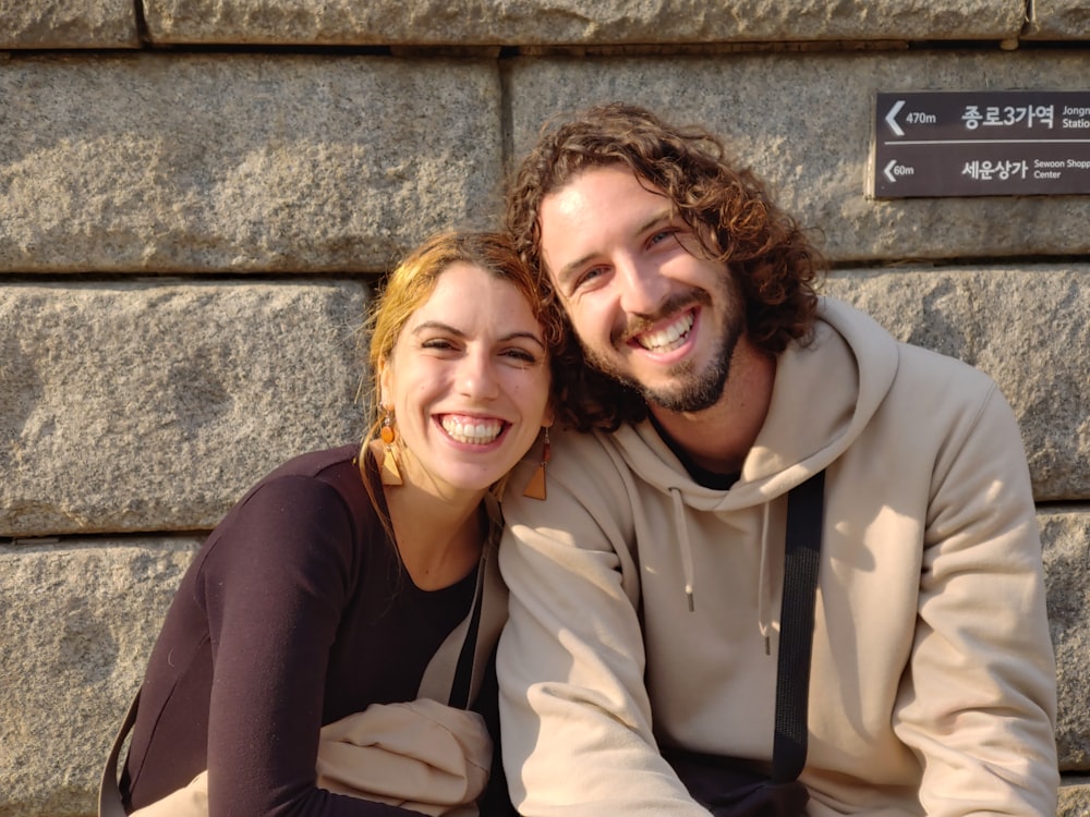 a man and a woman sitting next to each other