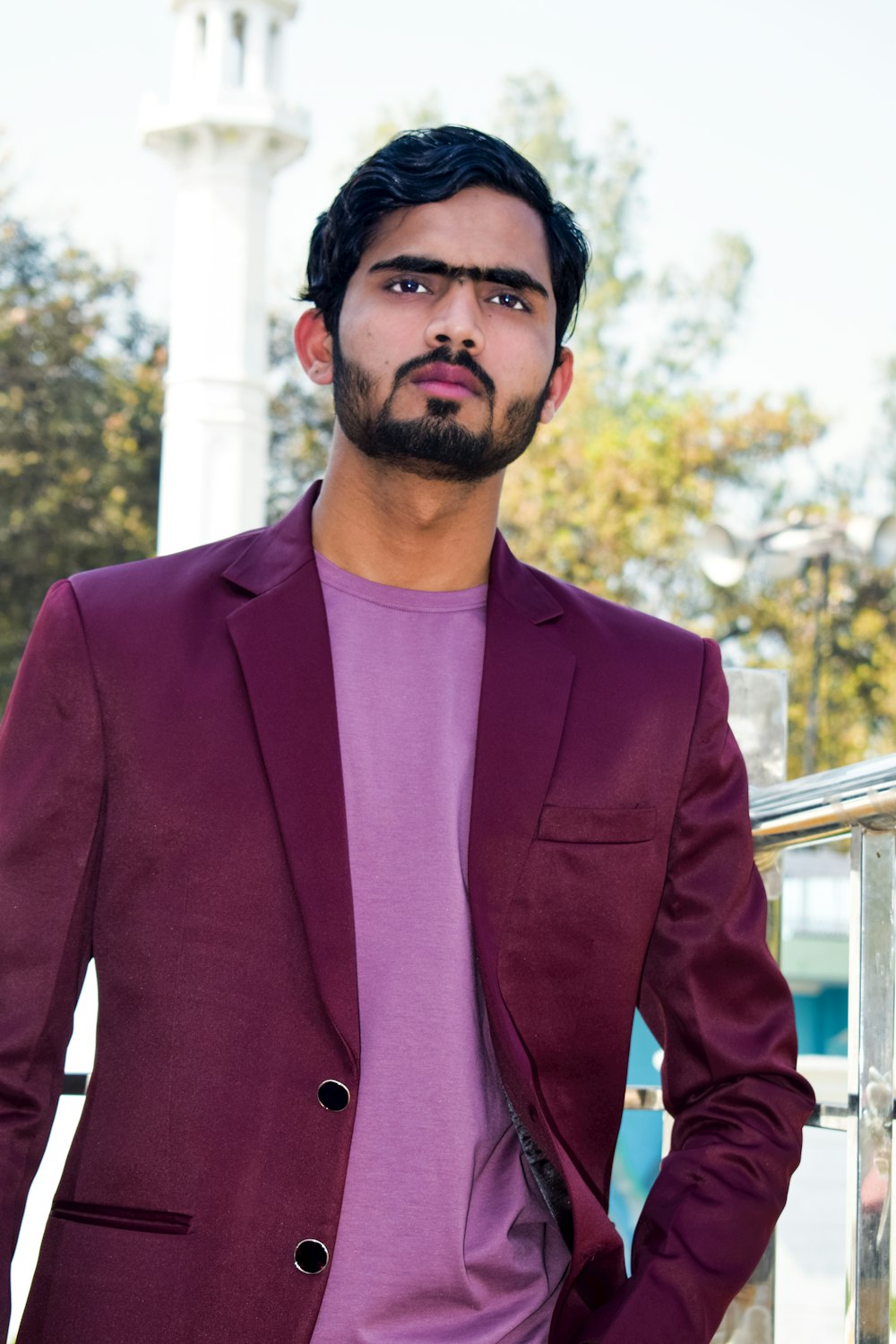 a man in a purple shirt and a purple blazer