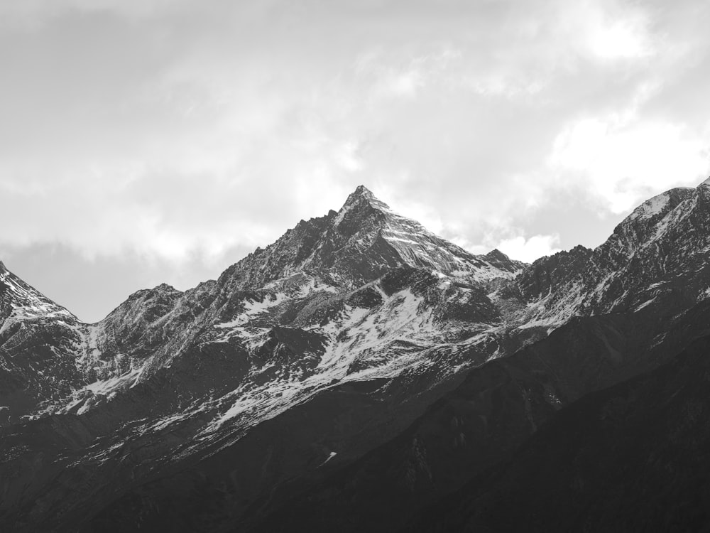 a black and white photo of a mountain range