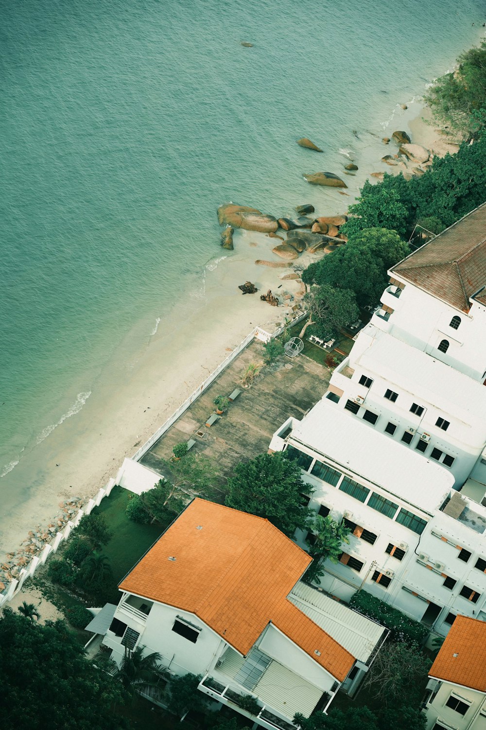 a bird's eye view of a beach and a house