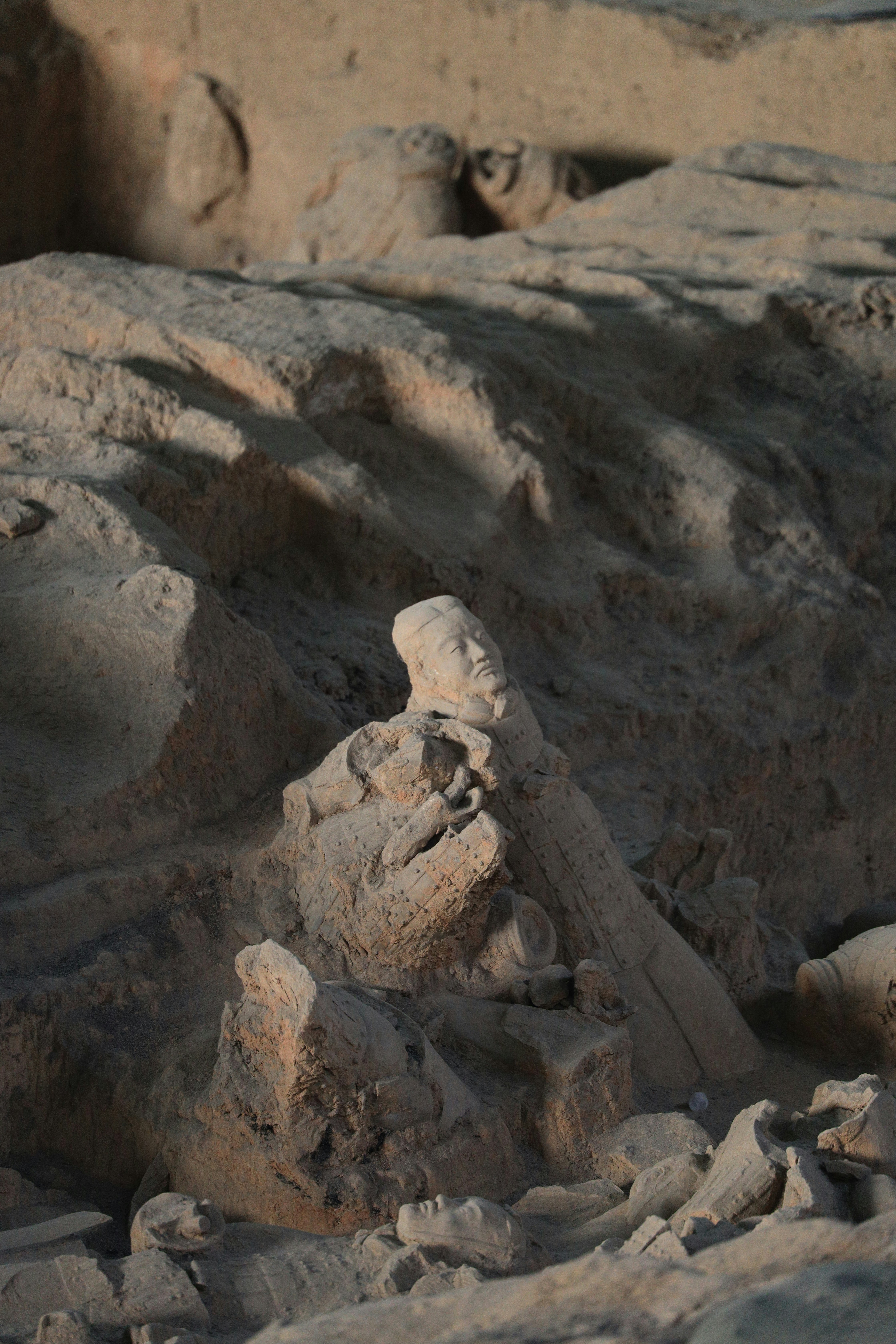 a rock formation with a bird perched on top of it