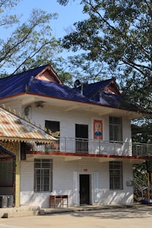 a large white building with a blue roof