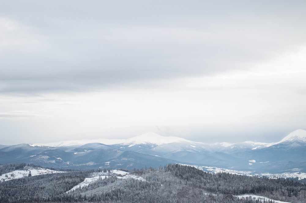 a view of a snowy mountain range from a distance