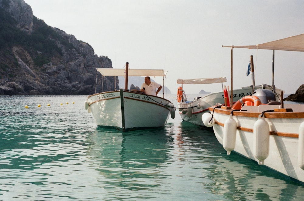 a couple of boats that are sitting in the water