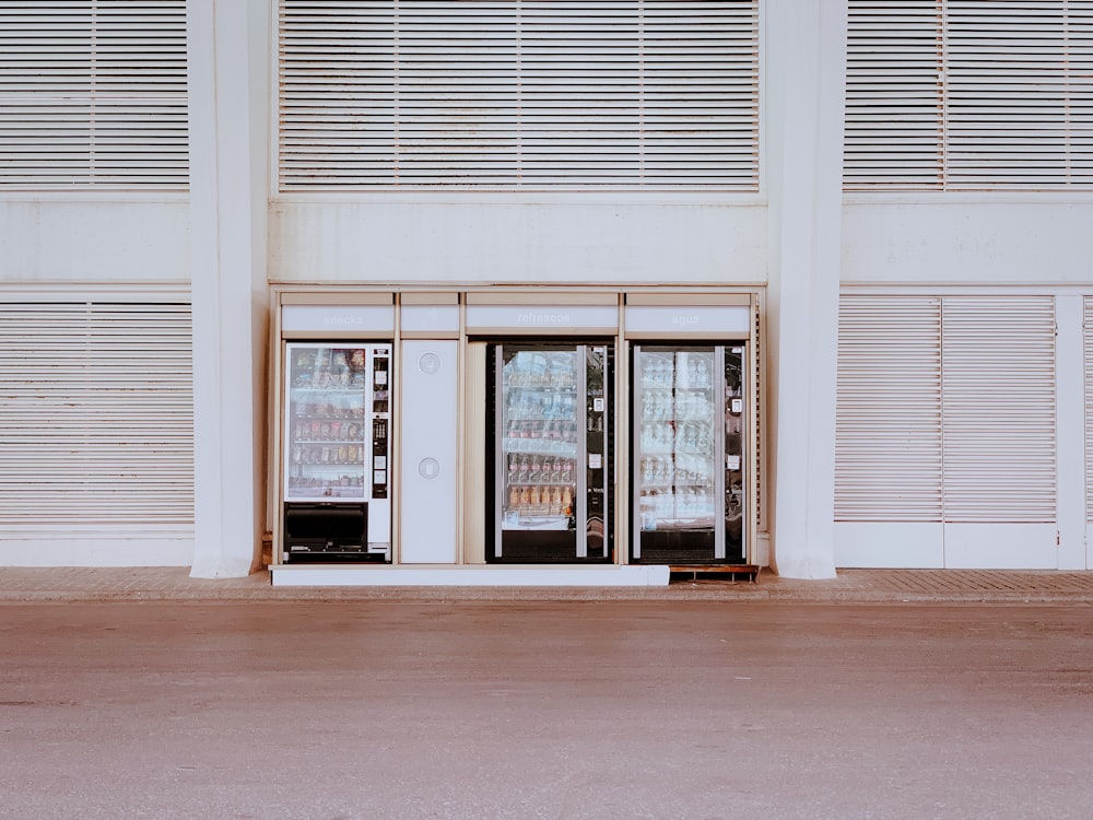 a store front with two refrigerators in front of it