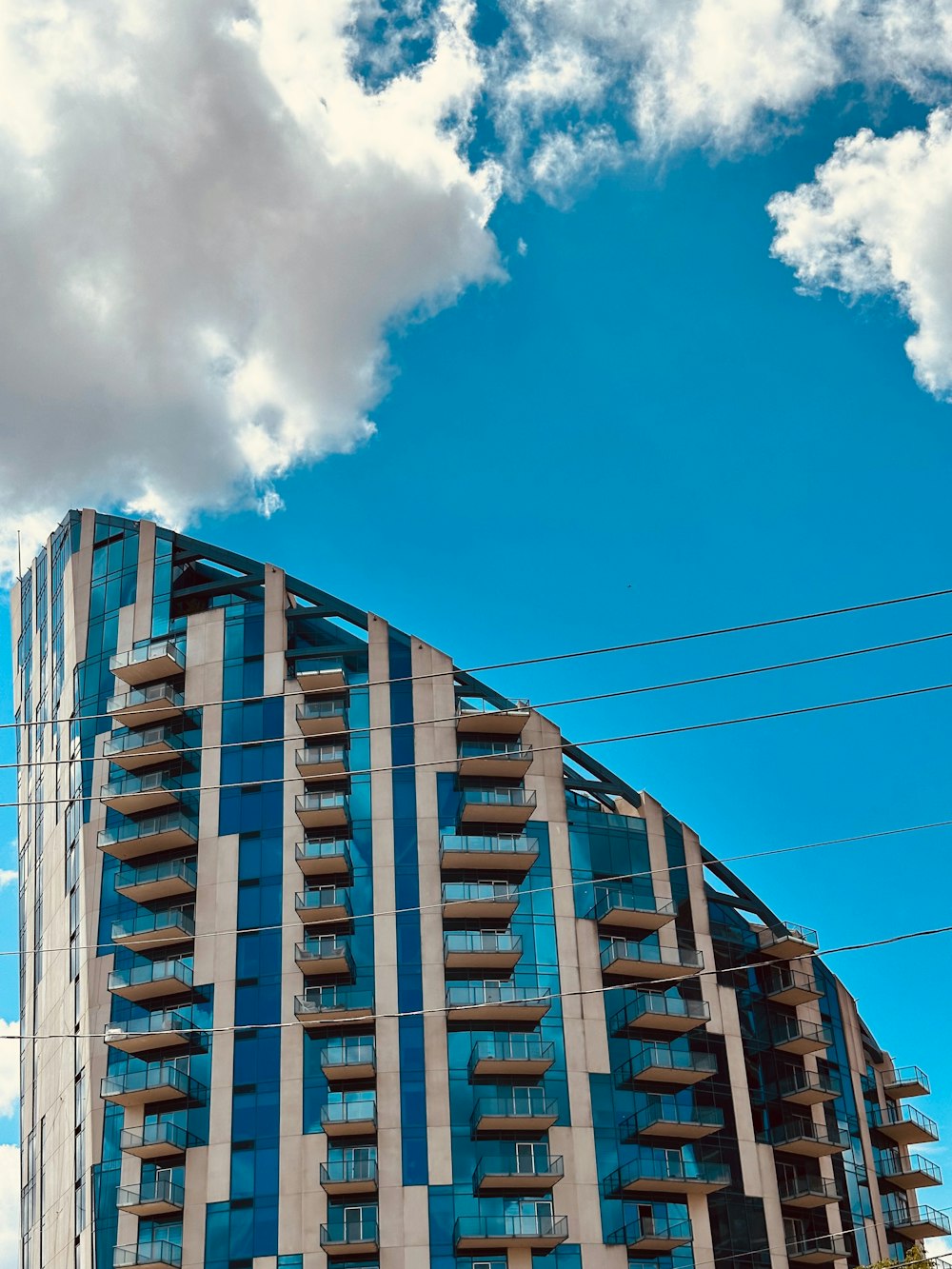 a very tall building with a sky background