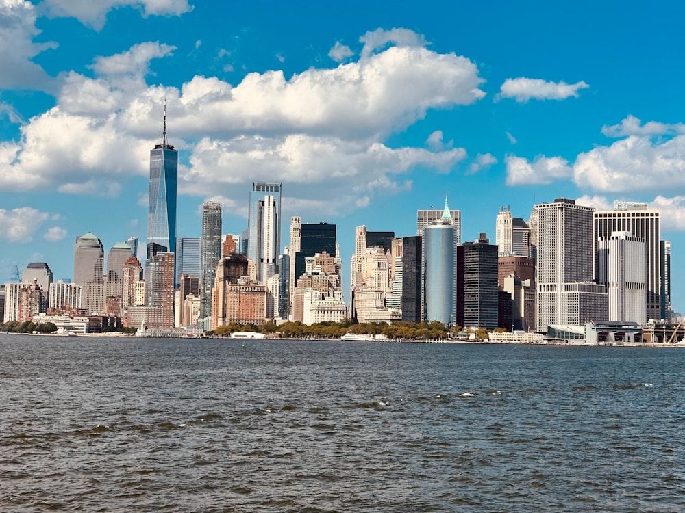 a large body of water with a city in the background