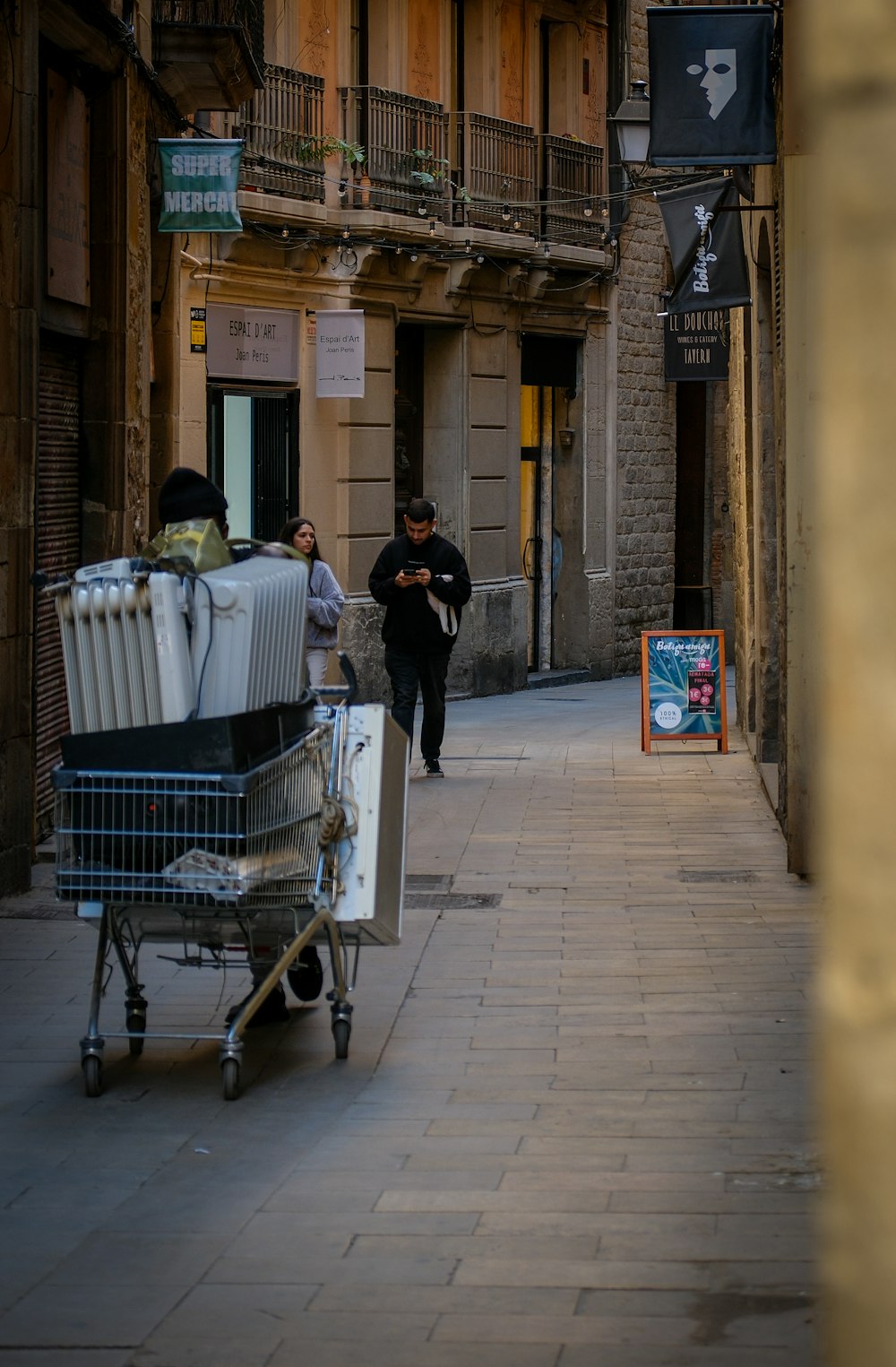 a shopping cart is parked on the side of the street