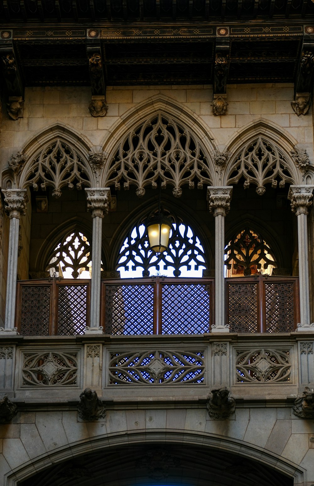 a building with a balcony and a clock on it