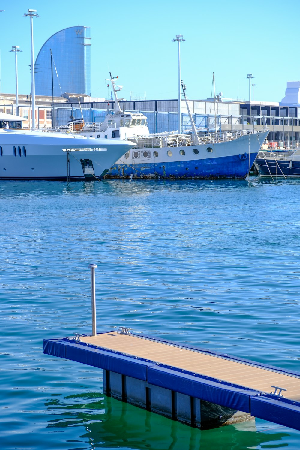 a boat docked at a pier in the water