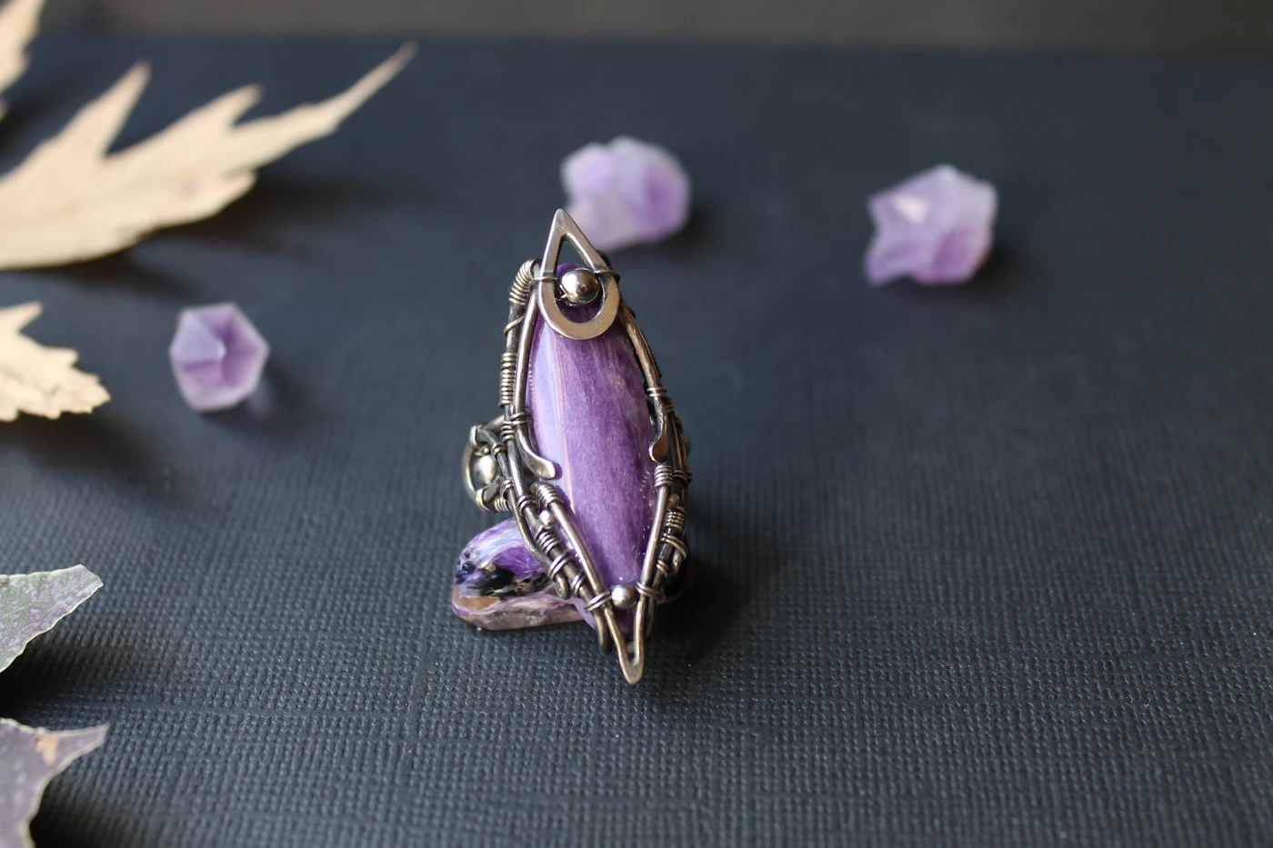 Sterling silver ring set with a faceted purple amethyst