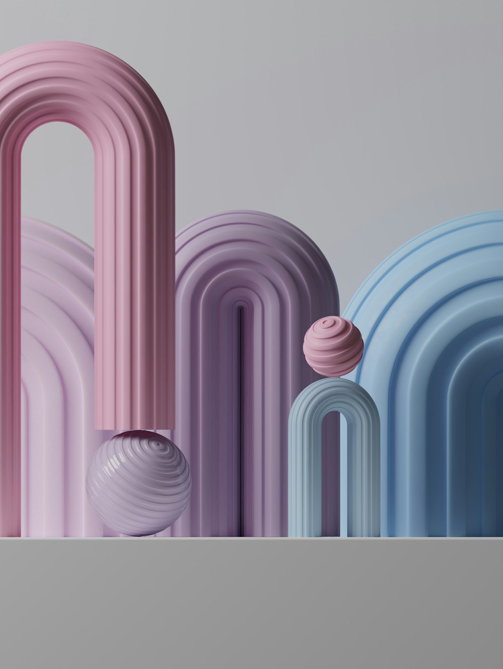 a group of pink, blue, and purple objects sitting on top of a table