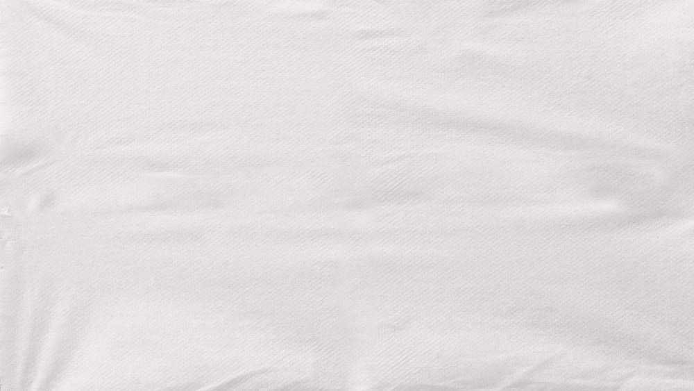 a close up of a white shirt on a white background