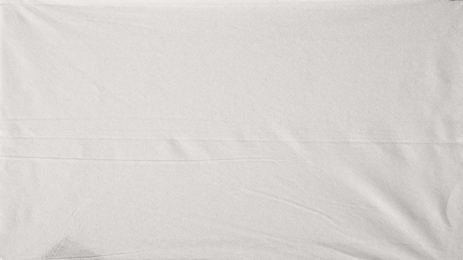 a black and white photo of a person laying on a bed