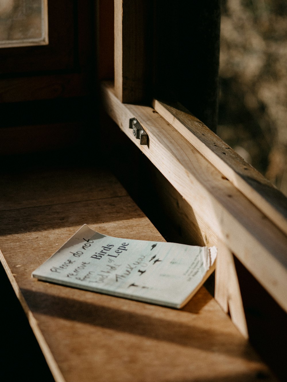 a piece of paper sitting on top of a wooden table