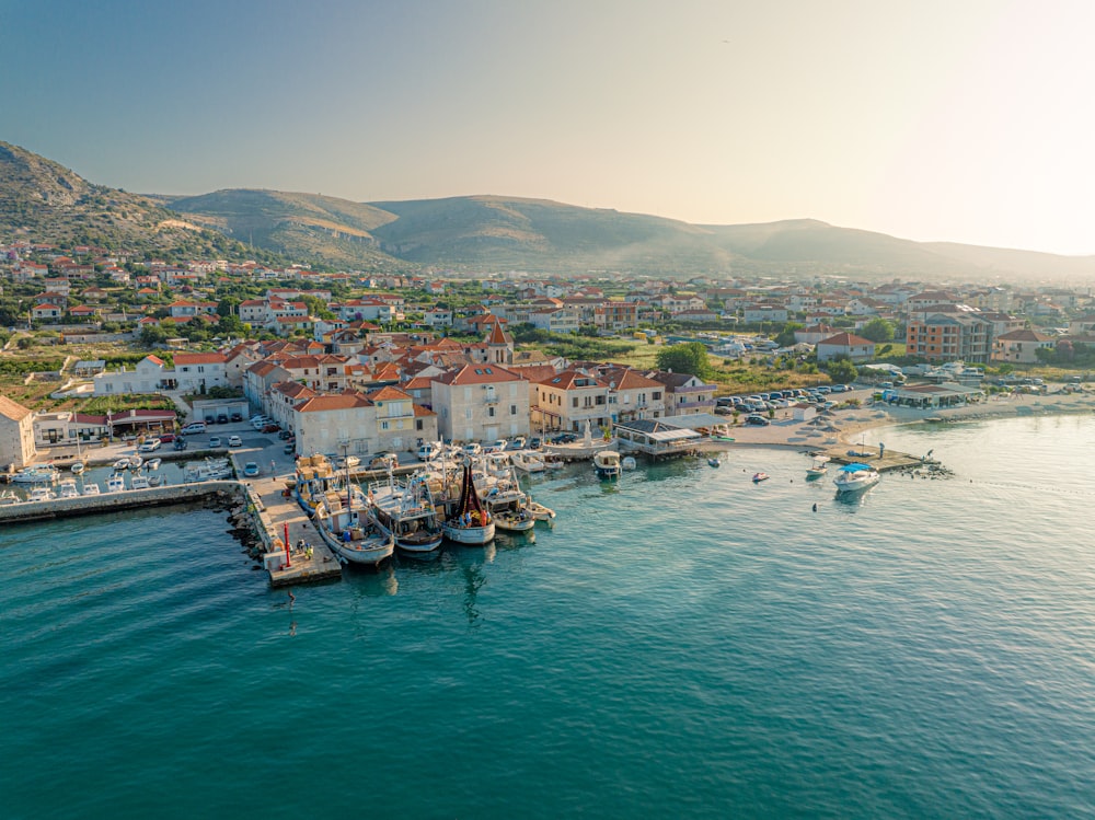 an aerial view of a harbor with boats in the water