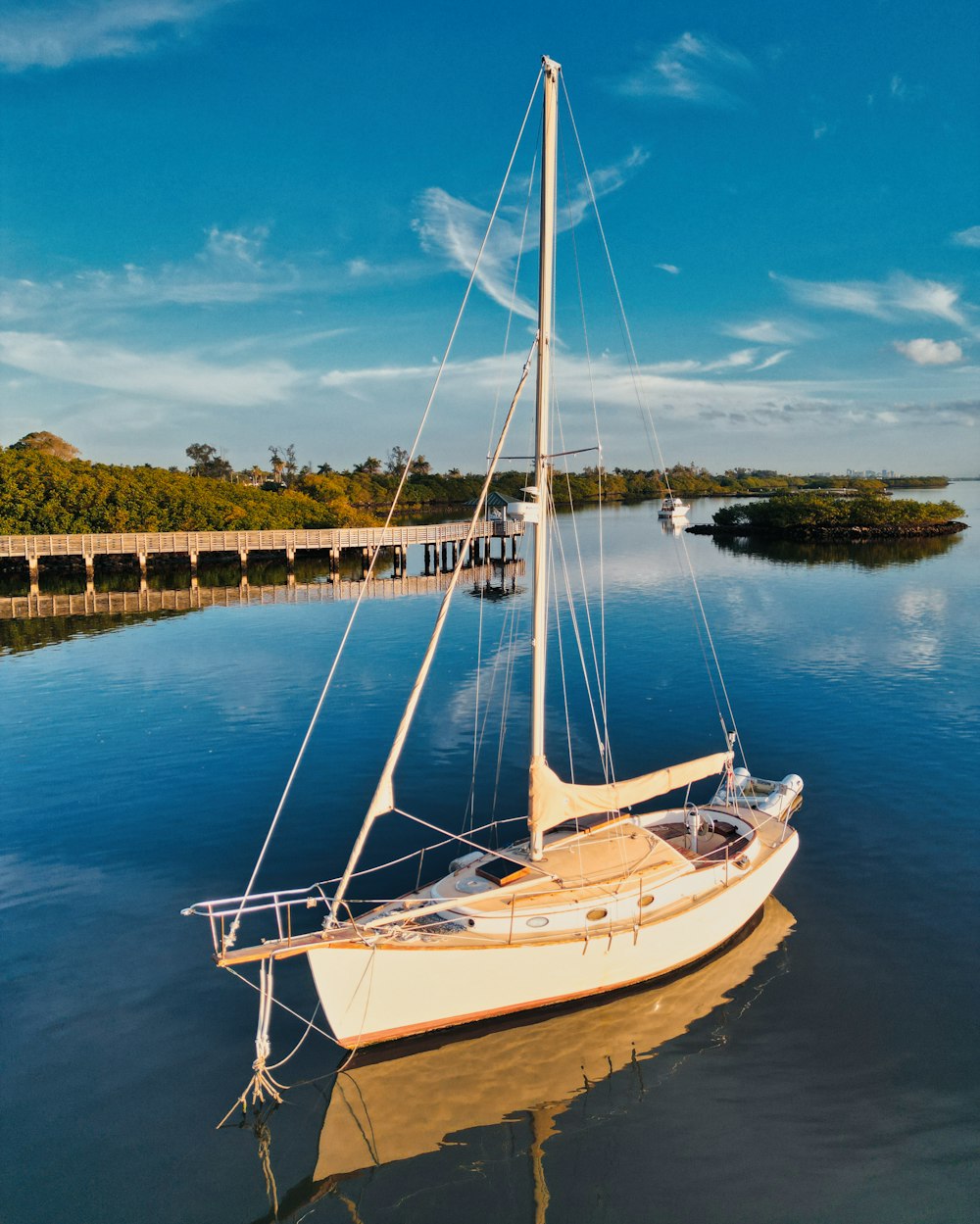 a sailboat floating on top of a body of water