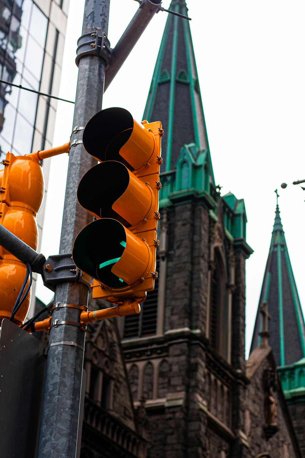 a traffic light in front of a tall building