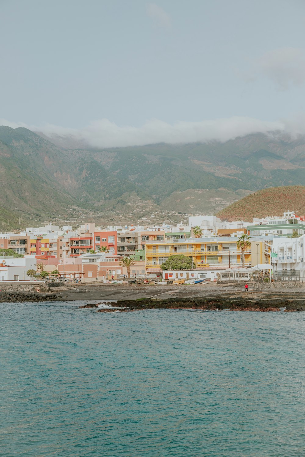 a view of a city from the ocean