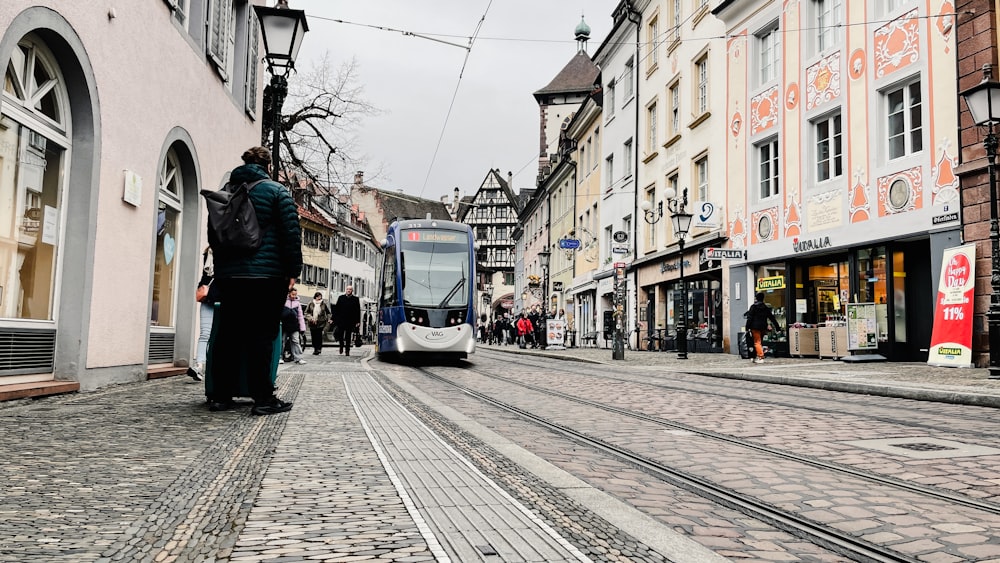 a person standing on a cobblestone street