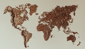 a map of the world made out of chocolate crumbs