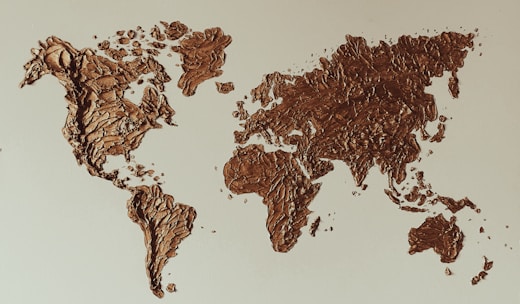 a map of the world made out of chocolate crumbs