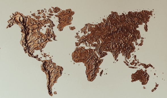 a map of the world made out of chocolate crumbs