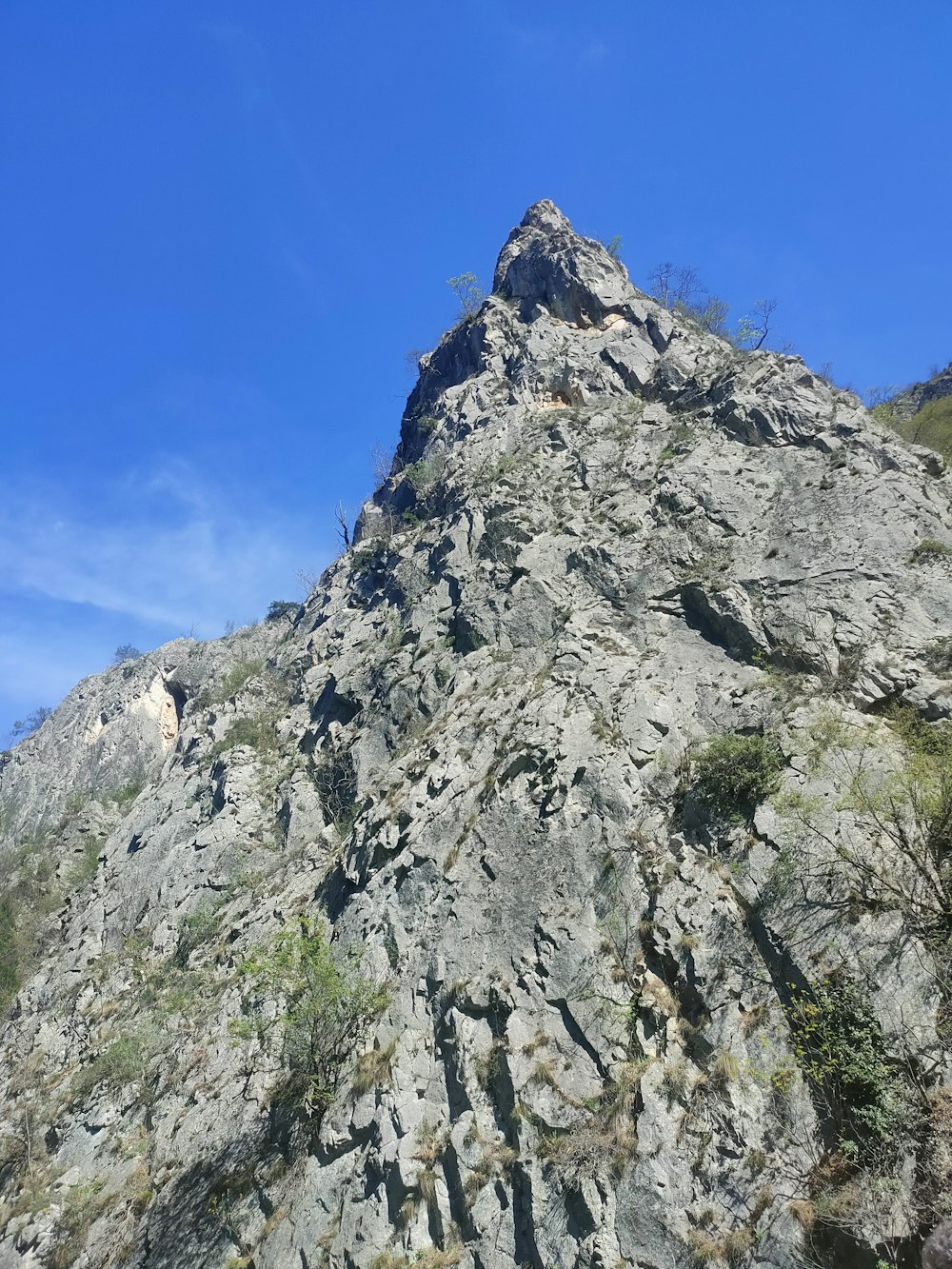 a very tall mountain with a sky background