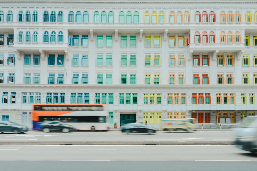 a white building with multicolored windows on the side of it
